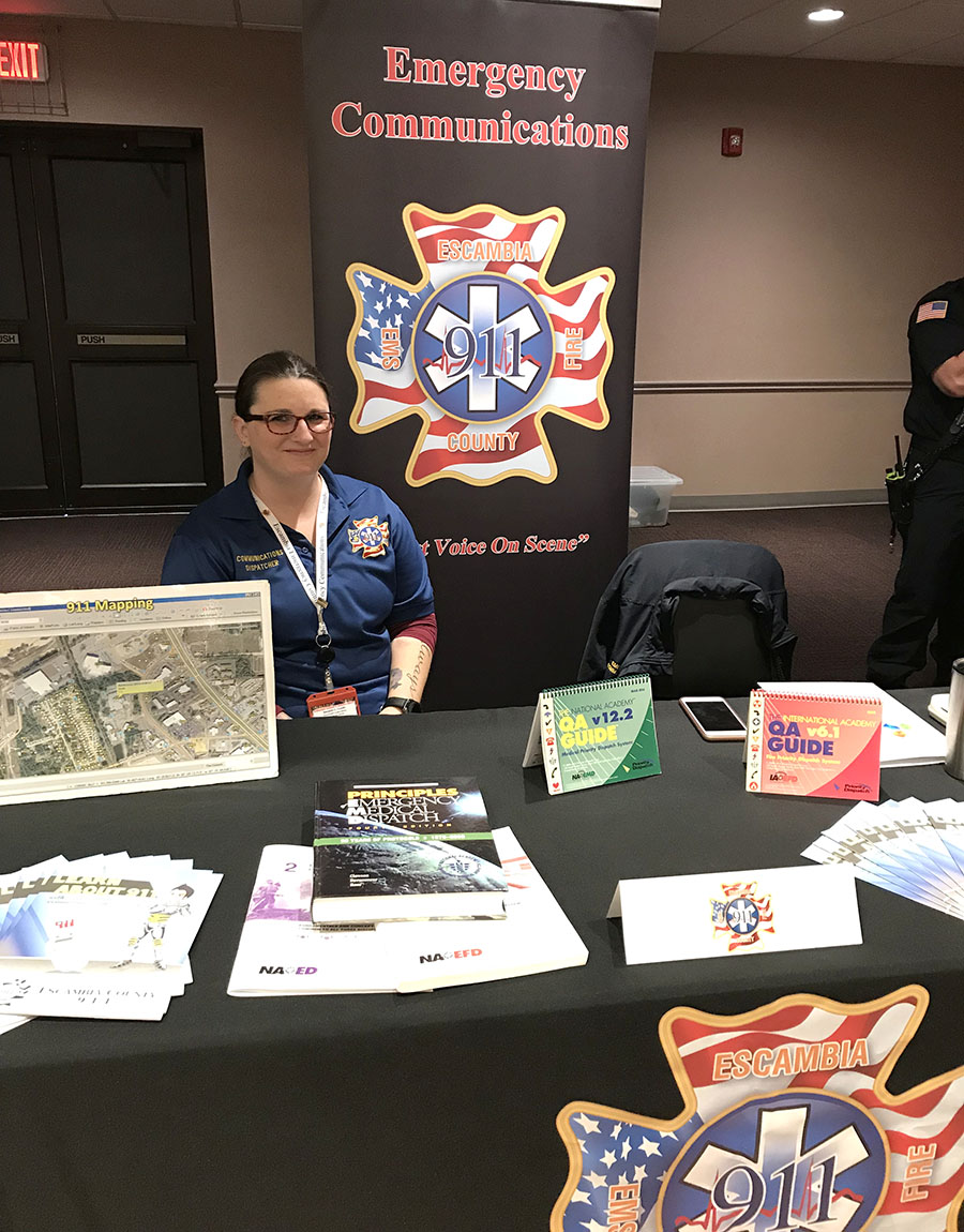 Emergency Communications staff at a table at an outreach event