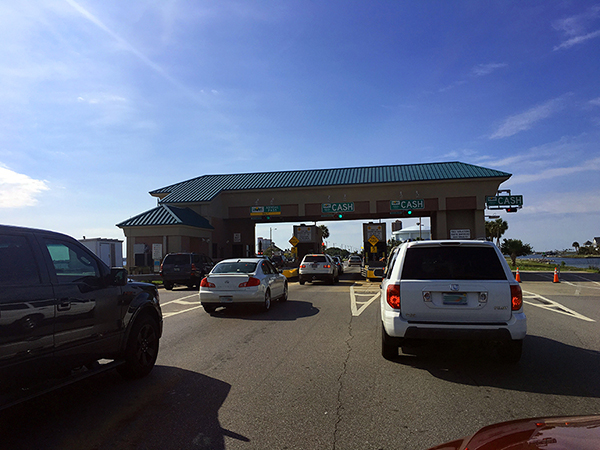 Cars at the toll plaza on the Bob Sikes Bridge on Pensacola Beach.